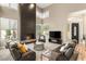 Bright living room showcasing a fireplace, comfortable seating, neutral colors, and lots of light at 8100 Lake Hills Dr, Las Vegas, NV 89128