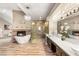 Luxurious bathroom with standalone tub, elegant chandelier, fireplace, glass shower, and dual vanities at 8100 Lake Hills Dr, Las Vegas, NV 89128