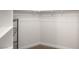 Walk-in closet featuring wire shelving and neutral carpeting at 8100 Lake Hills Dr, Las Vegas, NV 89128