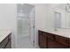 Modern bathroom features double sinks, tile floors, and a glass shower enclosure at 835 Jigglypuff Pl, Henderson, NV 89011