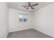 A bright bedroom with a ceiling fan and a window view at 835 Jigglypuff Pl, Henderson, NV 89011