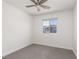 A bright bedroom with a ceiling fan and a window view at 835 Jigglypuff Pl, Henderson, NV 89011