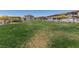 Community green space with lush grass, shaded picnic area, and walking paths at 835 Jigglypuff Pl, Henderson, NV 89011
