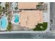 Stunning aerial view of the backyard with a unique pool and stylish tile roof at 8401 Airmont Ct, Las Vegas, NV 89128