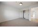 Spacious bedroom with neutral carpet and a closet with sliding doors at 8401 Airmont Ct, Las Vegas, NV 89128