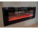 Sleek, modern fireplace creates a cozy ambiance in the living space at 8401 Airmont Ct, Las Vegas, NV 89128
