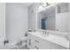 Bathroom features a white vanity with ample storage and a framed mirror at 8501 W University Ave # 1002, Las Vegas, NV 89147