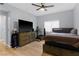 Bright bedroom with hardwood floors, neutral paint, and a large window at 8501 W University Ave # 1002, Las Vegas, NV 89147