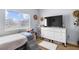 Bright bedroom with a large window and neutral paint at 8501 W University Ave # 1002, Las Vegas, NV 89147