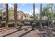 The Fiesta community has a well-manicured landscape surrounding the community signage at 8501 W University Ave # 1002, Las Vegas, NV 89147