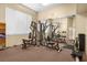 A well-equipped gym with a variety of weight machines and mirrors creating an open space for exercise at 8501 W University Ave # 1002, Las Vegas, NV 89147