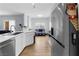 Open kitchen flows into the living area, stainless steel appliances, and sleek countertops at 8501 W University Ave # 1002, Las Vegas, NV 89147
