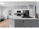Kitchen with stainless steel appliances, white cabinetry, and quartz countertops at 8501 W University Ave # 1002, Las Vegas, NV 89147