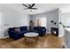 Stylishly furnished living room with a fireplace, wood floors, and modern lighting at 8501 W University Ave # 1002, Las Vegas, NV 89147