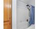 Bathroom includes a shower with tiled walls and a shower curtain at 8501 W University Ave # 1002, Las Vegas, NV 89147