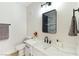 Bathroom features white marble countertop and modern black fixtures at 8501 W University Ave # 1042, Las Vegas, NV 89147