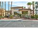 Mediterranean-style building with desert landscaping and ample parking at 8501 W University Ave # 1042, Las Vegas, NV 89147