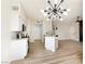 Spacious kitchen features stylish lighting, stainless steel appliances, and white cabinets at 8501 W University Ave # 1042, Las Vegas, NV 89147