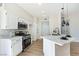 Bright kitchen features white cabinets, stainless steel appliances, and marble countertops at 8501 W University Ave # 1042, Las Vegas, NV 89147