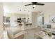 Open-concept living area showcasing light wood floors and a kitchen with a breakfast bar at 8501 W University Ave # 1042, Las Vegas, NV 89147