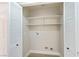 Interior pantry with shelves and washer/dryer hookups at 8501 W University Ave # 1042, Las Vegas, NV 89147