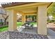 Community picnic area with a table and grill surrounded by green space at 8501 W University Ave # 1042, Las Vegas, NV 89147