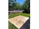 A clean concrete patio and lush green grass are in this backyard with privacy fence at 9360 Canalino Dr, Las Vegas, NV 89134