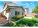 This backyard features a compact lawn area, a small patio, and some minimal landscaping, providing a simple outdoor space at 9360 Canalino Dr, Las Vegas, NV 89134