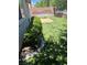 A well-maintained backyard featuring lush green grass and a small patio area at 9360 Canalino Dr, Las Vegas, NV 89134