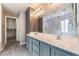 Dual sinks and lots of vanity space accent this main bathroom with direct access to a walk-in closet at 9360 Canalino Dr, Las Vegas, NV 89134