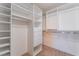A walk-in closet features built in shelving with room for plenty of clothes and storage space at 9360 Canalino Dr, Las Vegas, NV 89134