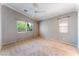 Neutral main bedroom with two windows providing bright natural light at 9360 Canalino Dr, Las Vegas, NV 89134