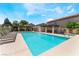 Beautiful community pool area with ample seating, shade, and a clear, refreshing pool at 9360 Canalino Dr, Las Vegas, NV 89134