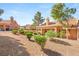 Picturesque backyard with desert landscaping, and a covered patio, creating a serene outdoor space at 9445 January Dr, Las Vegas, NV 89134