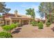 Spacious backyard with desert landscaping and a covered patio, perfect for outdoor entertaining at 9445 January Dr, Las Vegas, NV 89134