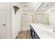 Bathroom vanity with double sinks, large mirrors with Hollywood lights and walk-in shower at 9445 January Dr, Las Vegas, NV 89134
