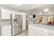 Modern kitchen with stainless steel refrigerator and plenty of cabinet storage space at 9445 January Dr, Las Vegas, NV 89134