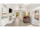 Bright living room with fireplace, hardwood floors and ceiling fan at 9445 January Dr, Las Vegas, NV 89134