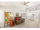 Open floor plan living room with a view of the kitchen and wood-look tile flooring at 9445 January Dr, Las Vegas, NV 89134