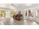 Bright living room features wood-look tile flooring and multiple windows for natural light at 9445 January Dr, Las Vegas, NV 89134