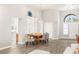 Bright dining room featuring gray chairs, hardwood floors and large windows at 9445 January Dr, Las Vegas, NV 89134