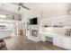 Bright living room with a fireplace, built-in shelving, and views into the kitchen at 9445 January Dr, Las Vegas, NV 89134