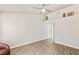 Bright living room featuring tile floors, vaulted ceiling with art niche and neutral decor at 9445 January Dr, Las Vegas, NV 89134