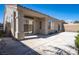 The backyard features a covered patio, offering space for outdoor relaxation at 9710 Geiger Peak Ct, Las Vegas, NV 89148