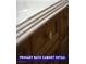 Close up detail of the primary bathroom's wood-grain cabinetry and light countertop at 9710 Geiger Peak Ct, Las Vegas, NV 89148