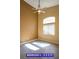 Bedroom with high ceilings, wood-look floors, neutral paint, and natural lighting from a large window at 9710 Geiger Peak Ct, Las Vegas, NV 89148