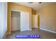 Bedroom featuring wood-look floors, neutral paint, closet, and neutral doors at 9710 Geiger Peak Ct, Las Vegas, NV 89148