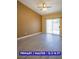 Spacious primary bedroom featuring wood-look floors and sliding glass doors leading to the backyard at 9710 Geiger Peak Ct, Las Vegas, NV 89148