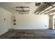 Clean two-car garage featuring overhead storage racks at 9710 Geiger Peak Ct, Las Vegas, NV 89148