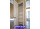Hallway linen closet view with open door and interior shelves, leading to a bathroom at 9710 Geiger Peak Ct, Las Vegas, NV 89148